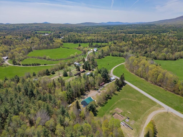 26 Christen Rd, Kingfield, ME 04947 - aerial view of property and surrounding area with a heavily wooded area, a mountainous background, and rural landscape