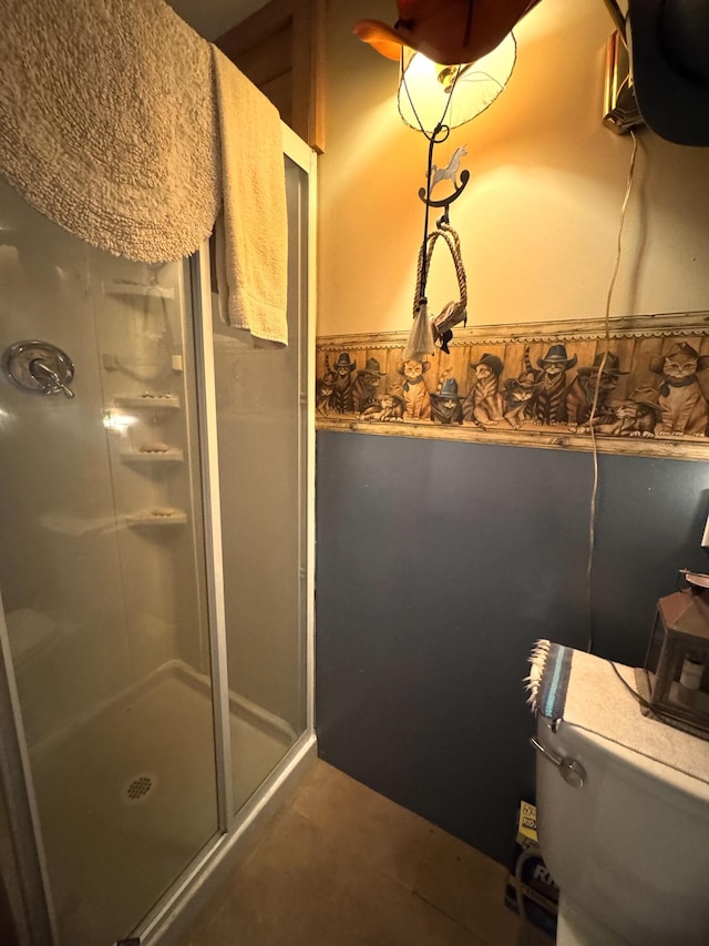 7 Howard Siding Ln, Abbot, ME 04406 - bathroom with a stall shower, tile patterned floors, and toilet
