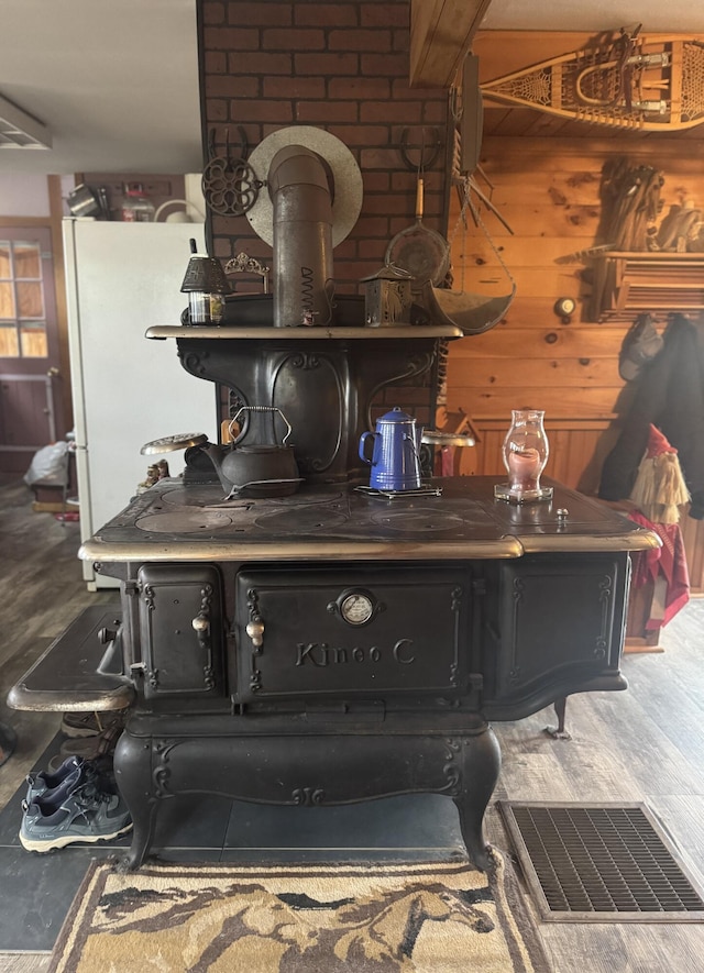 7 Howard Siding Ln, Abbot, ME 04406 - detailed view of wood finished floors and a wood stove