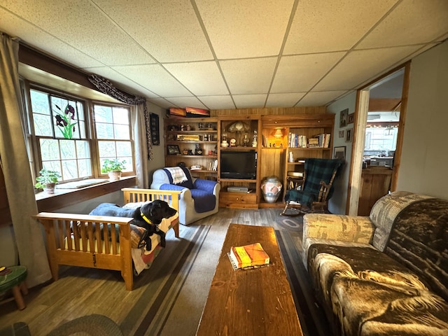 7 Howard Siding Ln, Abbot, ME 04406 - living area featuring hardwood / wood-style floors, built in features, and a drop ceiling