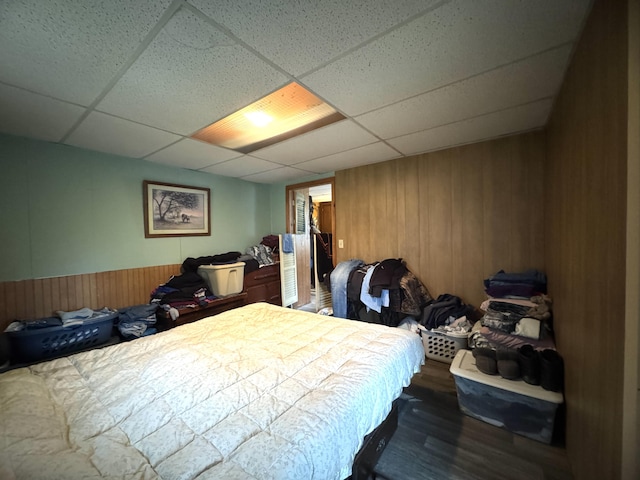 7 Howard Siding Ln, Abbot, ME 04406 - bedroom with wood finished floors, wooden walls, and a paneled ceiling