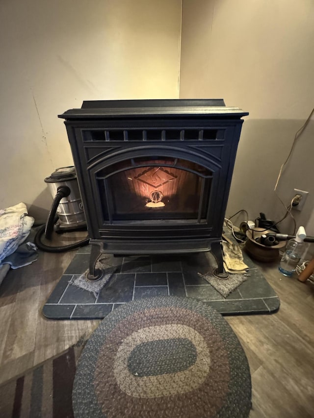 7 Howard Siding Ln, Abbot, ME 04406 - detailed view of wood finished floors and a wood stove