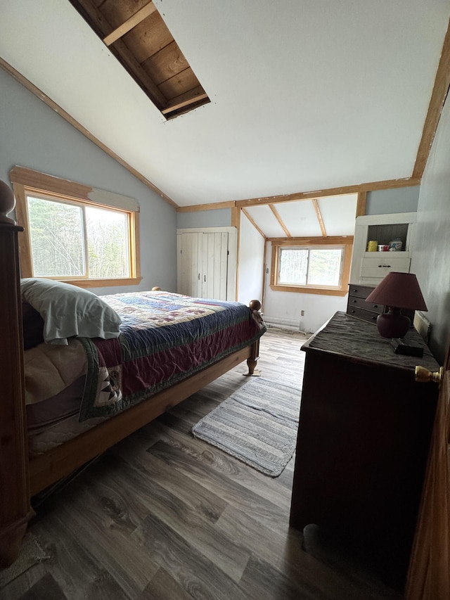 7 Howard Siding Ln, Abbot, ME 04406 - bedroom featuring vaulted ceiling and wood finished floors