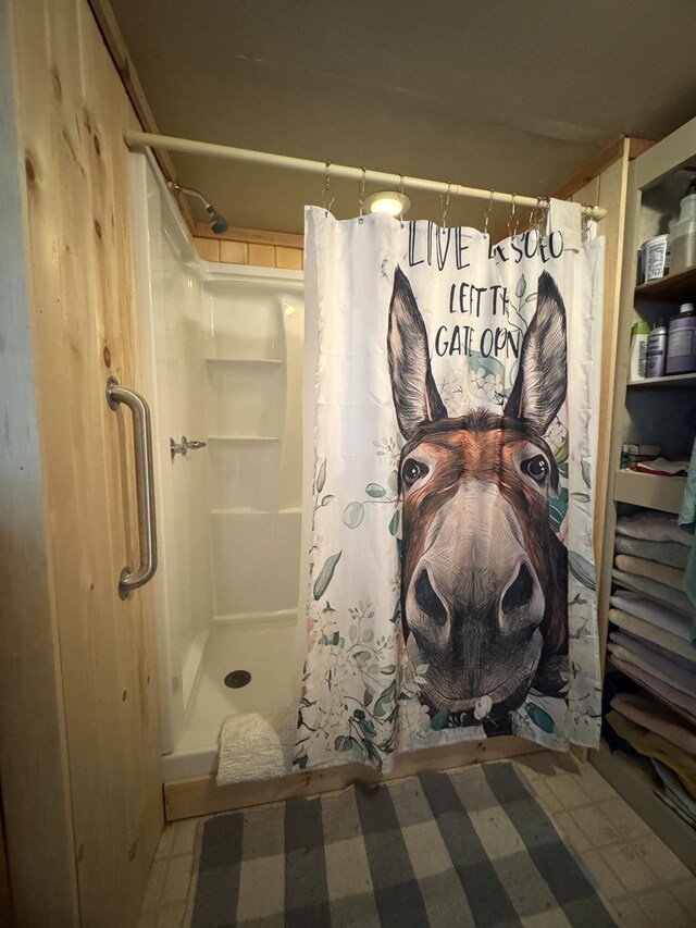 7 Howard Siding Ln, Abbot, ME 04406 - full bathroom featuring a stall shower and tile patterned floors