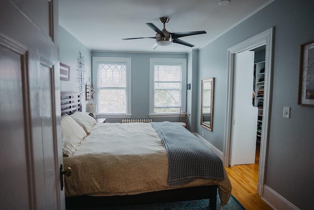 107 Maple St, Bangor, ME 04401 - bedroom featuring wood finished floors, baseboards, ceiling fan, and ornamental molding