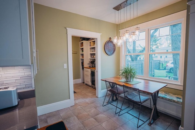 107 Maple St, Bangor, ME 04401 - dining space with baseboards and a chandelier