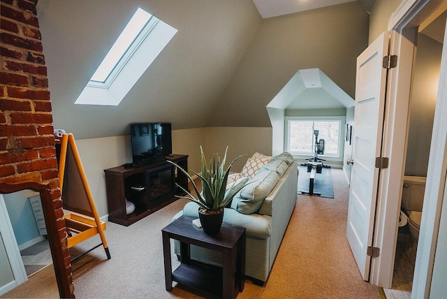 107 Maple St, Bangor, ME 04401 - living room with a skylight, carpet, vaulted ceiling, and baseboards