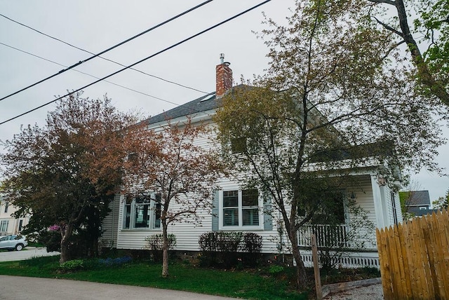 107 Maple St, Bangor, ME 04401 - view of property exterior featuring fence and a chimney