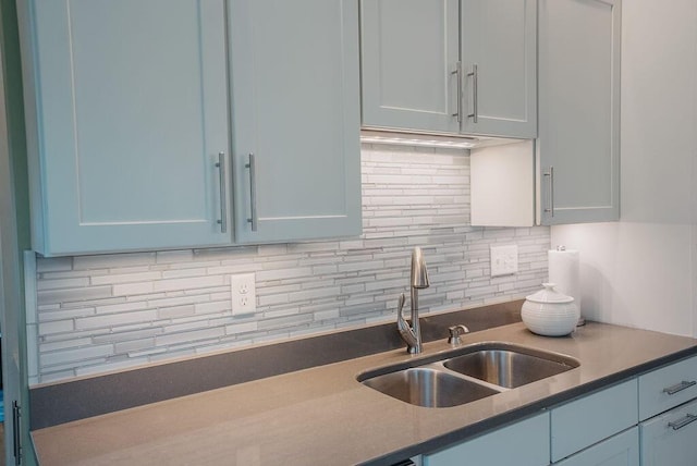 107 Maple St, Bangor, ME 04401 - kitchen featuring a sink, tasteful backsplash, and dark countertops