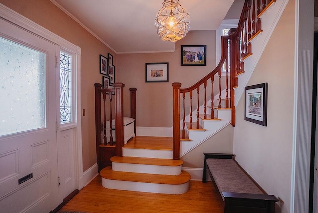 107 Maple St, Bangor, ME 04401 - entryway featuring stairway, wood finished floors, plenty of natural light, and baseboards