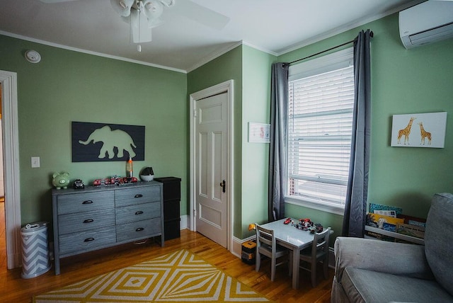 107 Maple St, Bangor, ME 04401 - living area with a wall unit AC, wood finished floors, plenty of natural light, a ceiling fan, and crown molding