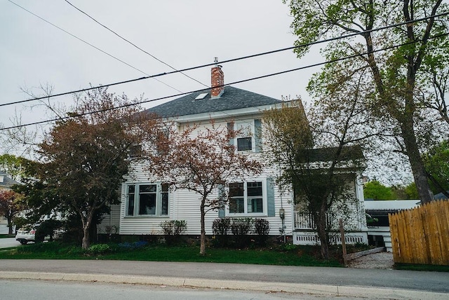 107 Maple St, Bangor, ME 04401 - colonial house featuring fence and a chimney