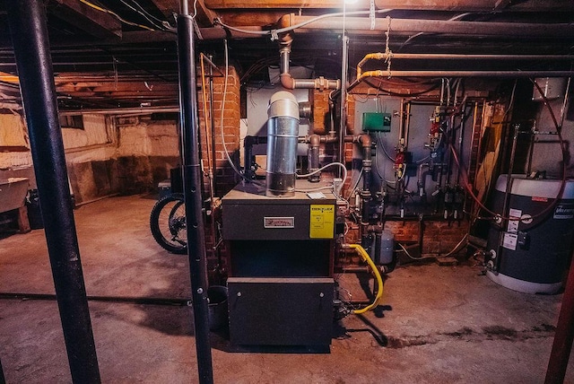 107 Maple St, Bangor, ME 04401 - utility room featuring water heater and a heating unit