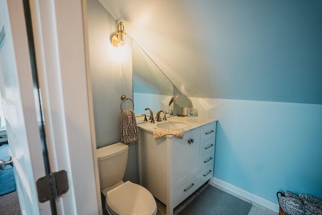 107 Maple St, Bangor, ME 04401 - half bathroom with toilet, vanity, and vaulted ceiling