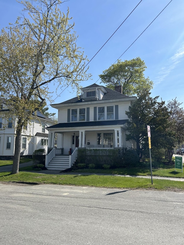 107 Maple St, Bangor, ME 04401 - traditional style home featuring a porch, a chimney, and a front yard