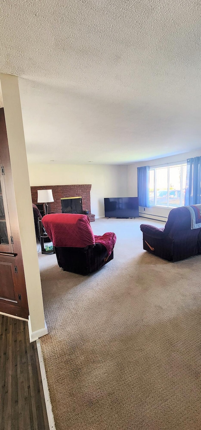 bedroom with a fireplace and dark wood finished floors