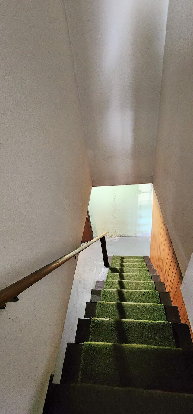 stairway with lofted ceiling
