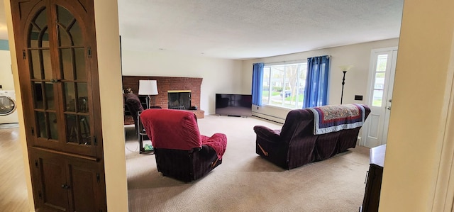 400 Birch St, Bangor, ME 04401 - living area with washer / dryer, a baseboard radiator, carpet floors, a fireplace, and a textured ceiling