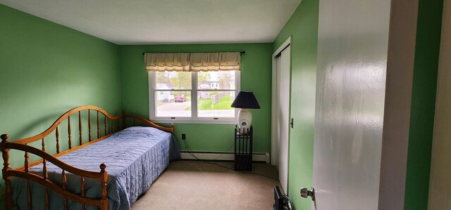 400 Birch St, Bangor, ME 04401 - carpeted bedroom featuring a baseboard radiator, baseboards, and a closet