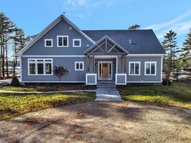 view of front of home with a shingled roof