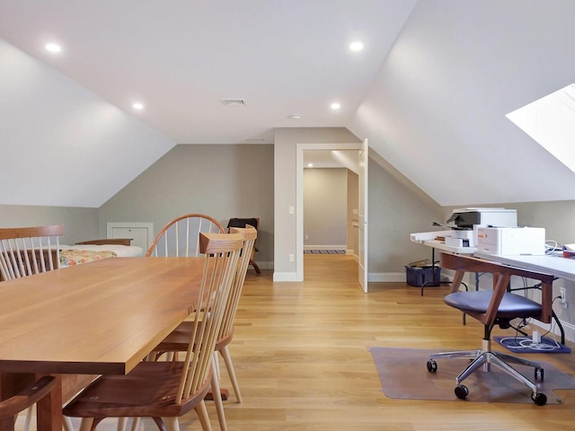 office area featuring light wood-type flooring, vaulted ceiling, baseboards, and recessed lighting