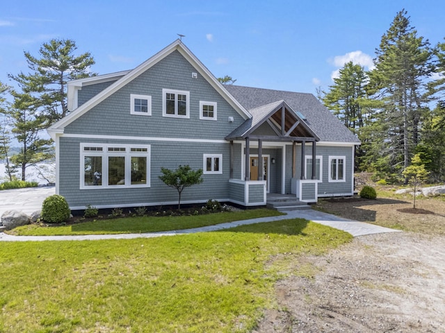 92 Brooks Cove Rd, Westport Island, ME 04578 - shingle-style home featuring a front lawn and roof with shingles