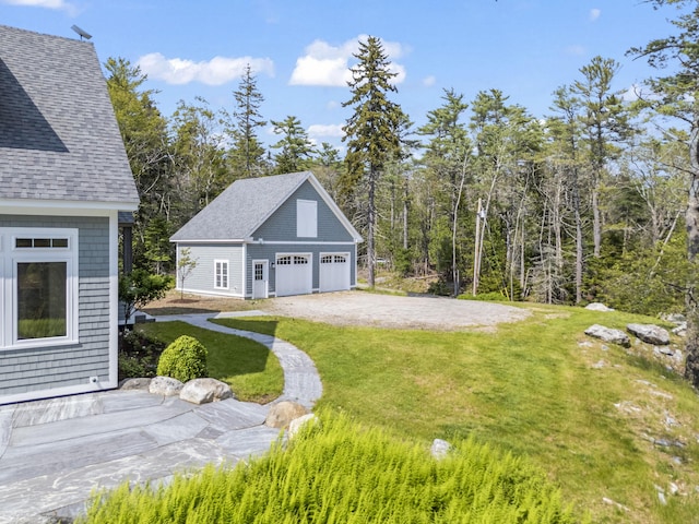 92 Brooks Cove Rd, Westport Island, ME 04578 - view of grassy yard featuring an outbuilding and a garage