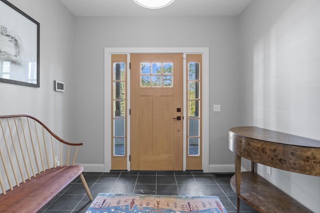 92 Brooks Cove Rd, Westport Island, ME 04578 - entrance foyer featuring baseboards and dark tile patterned floors