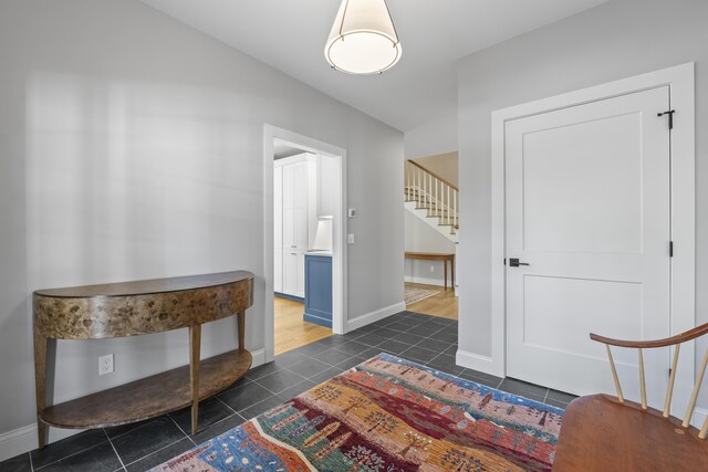 92 Brooks Cove Rd, Westport Island, ME 04578 - entryway featuring stairs, dark tile patterned flooring, and vaulted ceiling