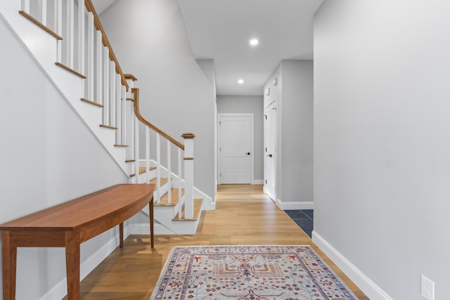 92 Brooks Cove Rd, Westport Island, ME 04578 - hallway featuring wood finished floors, stairs, and recessed lighting