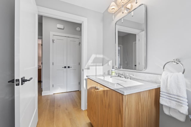 92 Brooks Cove Rd, Westport Island, ME 04578 - bathroom featuring vanity, wood finished floors, and a chandelier