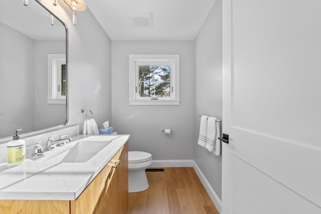 92 Brooks Cove Rd, Westport Island, ME 04578 - half bathroom featuring wood finished floors and vanity