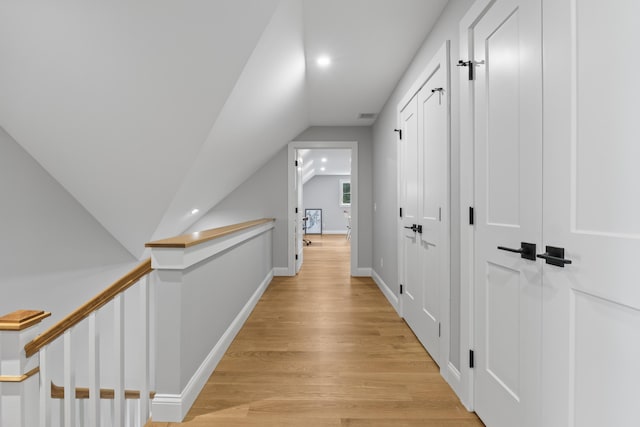 92 Brooks Cove Rd, Westport Island, ME 04578 - hall featuring vaulted ceiling, light wood finished floors, and recessed lighting