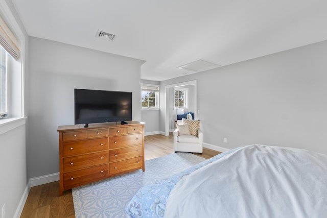 92 Brooks Cove Rd, Westport Island, ME 04578 - bedroom with attic access and wood finished floors