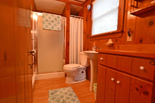 586 Kings Hwy Unit 2, Kennebunkport, ME 04046 - full bath featuring a stall shower, toilet, wood finished floors, and vanity