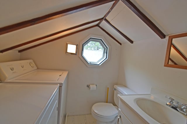 586 Kings Hwy Unit 2, Kennebunkport, ME 04046 - half bathroom with independent washer and dryer, vanity, toilet, and lofted ceiling