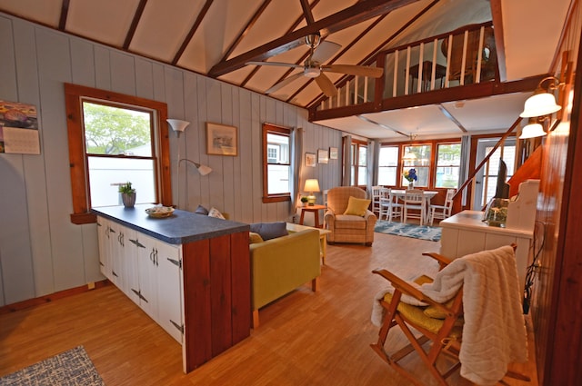 586 Kings Hwy Unit 2, Kennebunkport, ME 04046 - kitchen with a peninsula, light wood finished floors, ceiling fan, dark countertops, and open floor plan