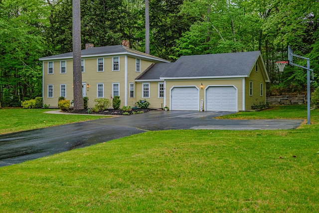 55 Evergreen Ln, Windham, ME 04062 - colonial home with driveway, an attached garage, a chimney, a front lawn, and a shingled roof