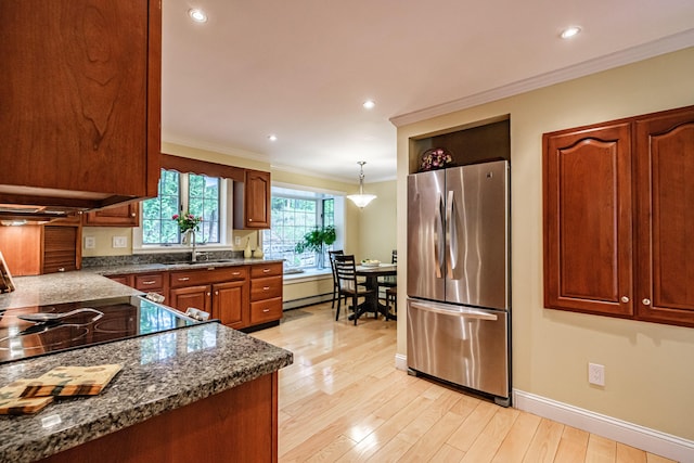 55 Evergreen Ln, Windham, ME 04062 - kitchen featuring freestanding refrigerator, a sink, crown molding, light wood-type flooring, and baseboards
