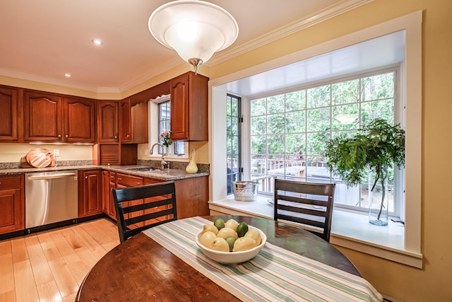 55 Evergreen Ln, Windham, ME 04062 - kitchen with stainless steel dishwasher, a sink, plenty of natural light, ornamental molding, and brown cabinetry