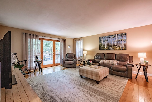 55 Evergreen Ln, Windham, ME 04062 - living room with hardwood / wood-style floors, baseboards, and french doors