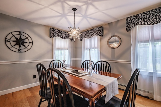 55 Evergreen Ln, Windham, ME 04062 - dining room with light wood-style floors and baseboards