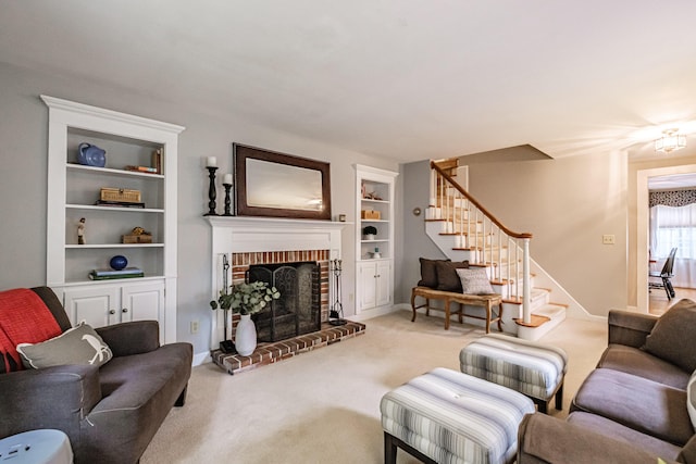 55 Evergreen Ln, Windham, ME 04062 - carpeted living room with stairs, built in features, a brick fireplace, and baseboards