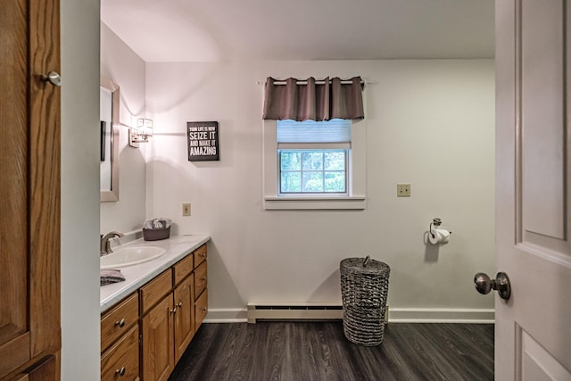 55 Evergreen Ln, Windham, ME 04062 - bathroom featuring a baseboard radiator, wood finished floors, baseboards, and vanity