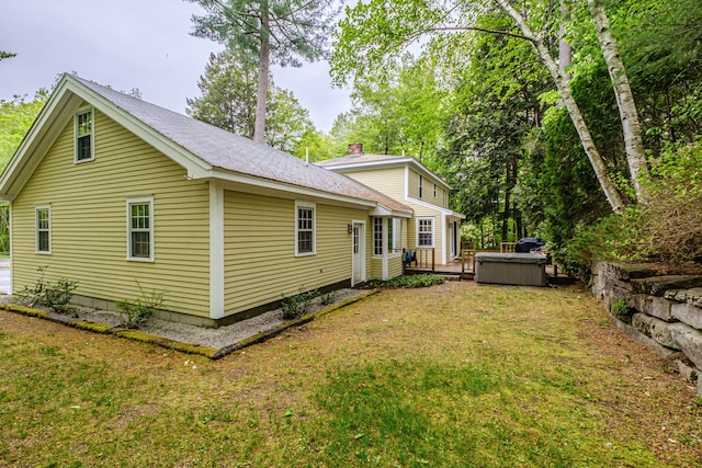 55 Evergreen Ln, Windham, ME 04062 - back of property with a lawn, a deck, and roof with shingles