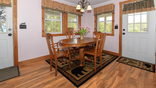 53 Branch Brook Ln, Newfield, ME 04095 - dining space with a chandelier, light wood-style flooring, and baseboards