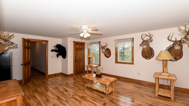 53 Branch Brook Ln, Newfield, ME 04095 - sitting room with wood finished floors, ceiling fan, and baseboards