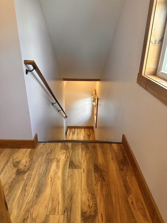 53 Branch Brook Ln, Newfield, ME 04095 - stairway featuring wood finished floors, baseboards, and vaulted ceiling