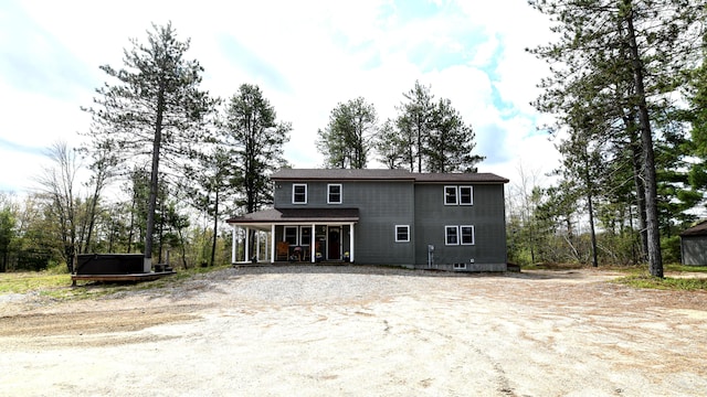 53 Branch Brook Ln, Newfield, ME 04095 - back of property with a porch and a hot tub
