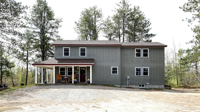 53 Branch Brook Ln, Newfield, ME 04095 - view of front of home with a porch, gravel driveway, and a shingled roof